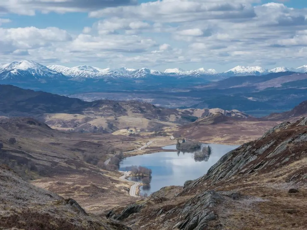 a view of a valley with snow capped mountains at Lann Dearg Studios in Invermoriston