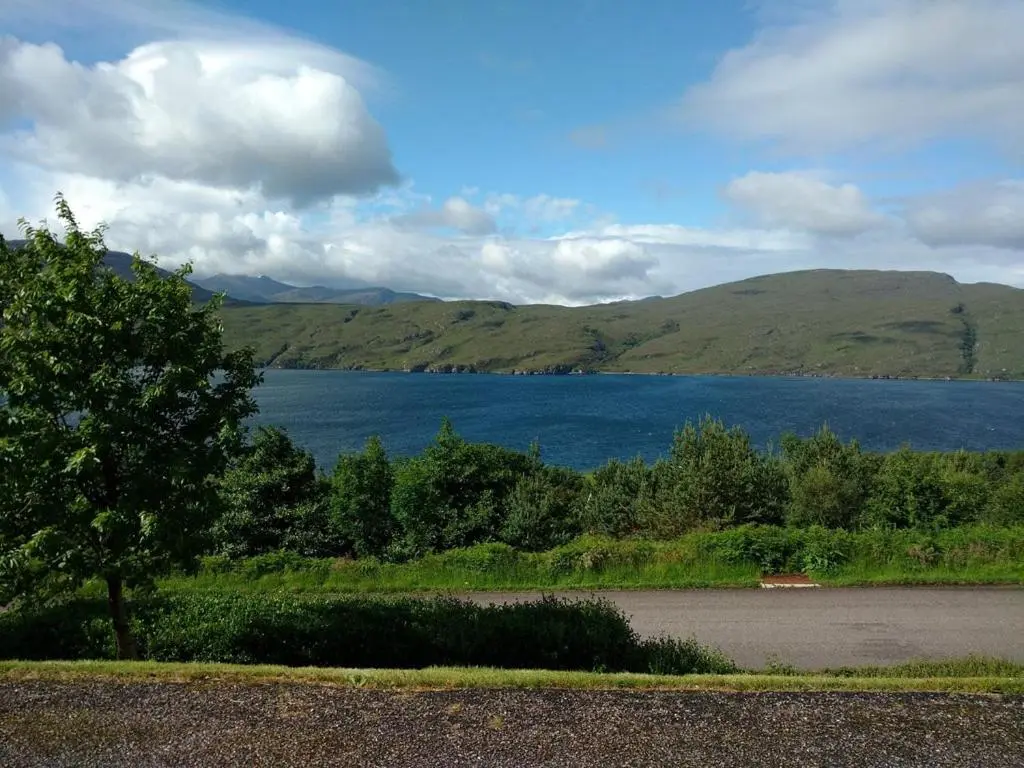 a view of a lake with mountains in the background at Ardlair Guest House in Ullapool