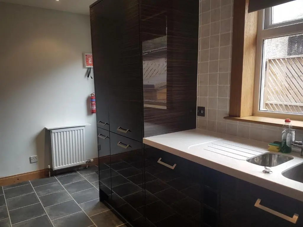 a bathroom with a sink and a shower at Jane's Place Free Parking in Inverness