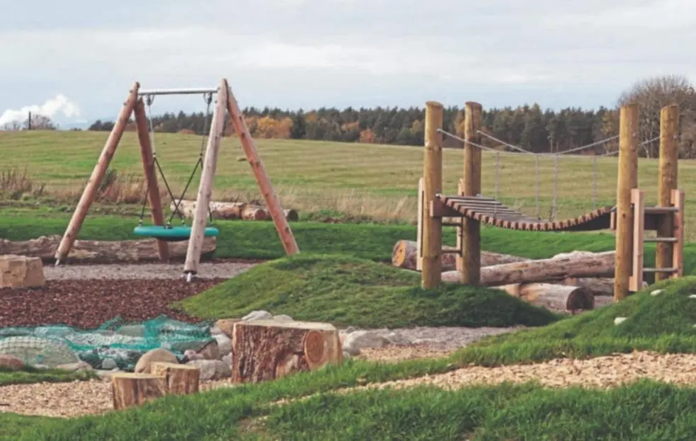 a playground with a swing set and a slide at Olavat Cottage detached property with parking in Inverness