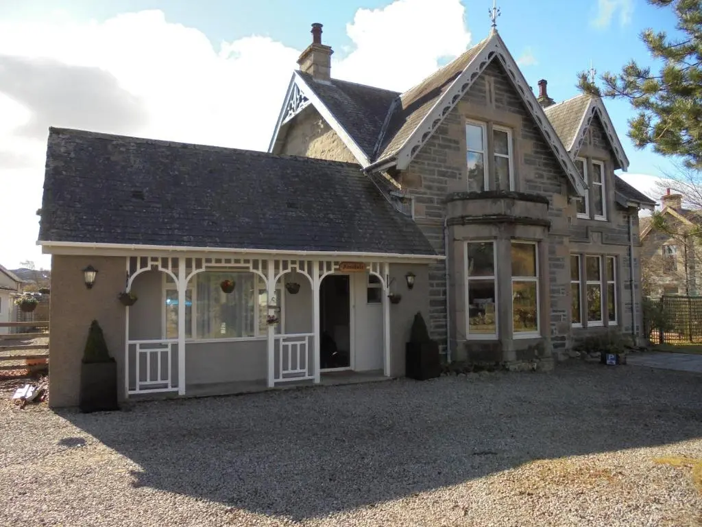 an old house with a lot of windows at Avondale House in Kingussie