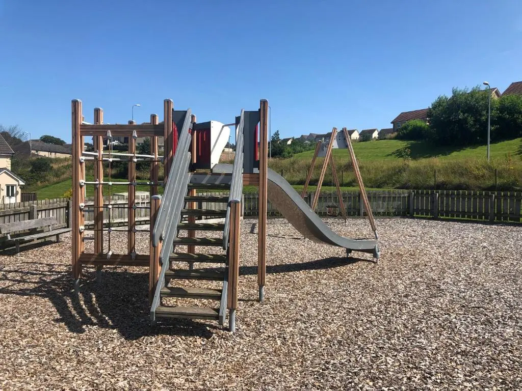a playground with a slide at Morning Field Apartment Free Parking in Inverness