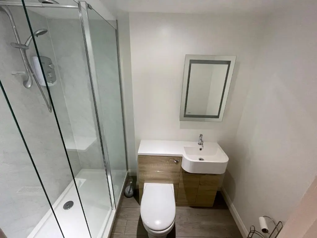 a bathroom with a toilet and a sink and a shower at Serviced Accommodation Moray in Elgin