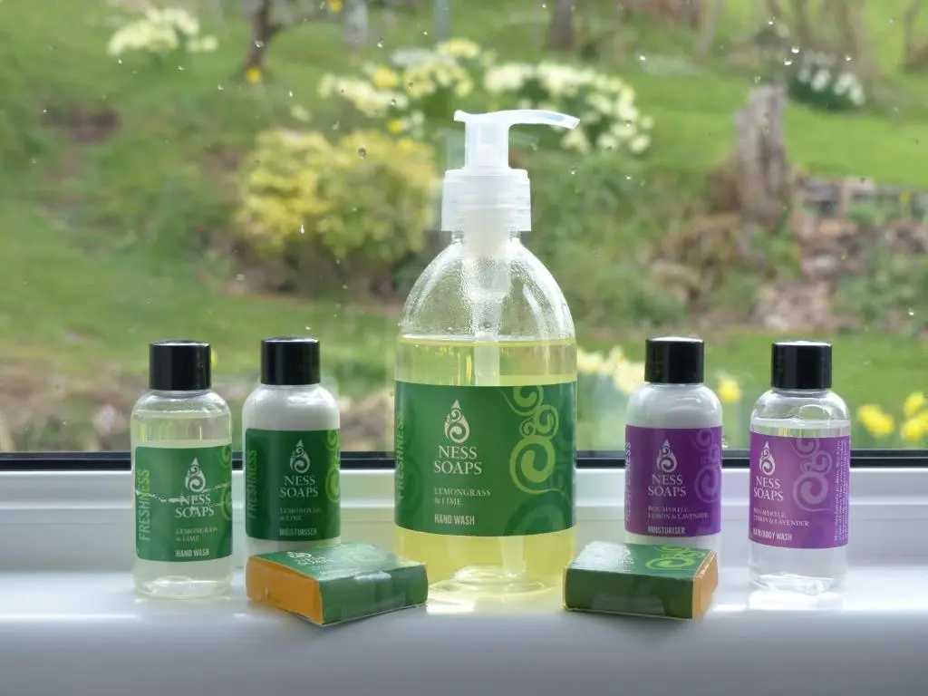 a group of three bottles of soap and a bottle of cleaner at Urquhart Bay Croft in Drumnadrochit