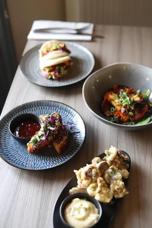 a table with three plates of food on it at Ardennan House Hotel in Inverurie