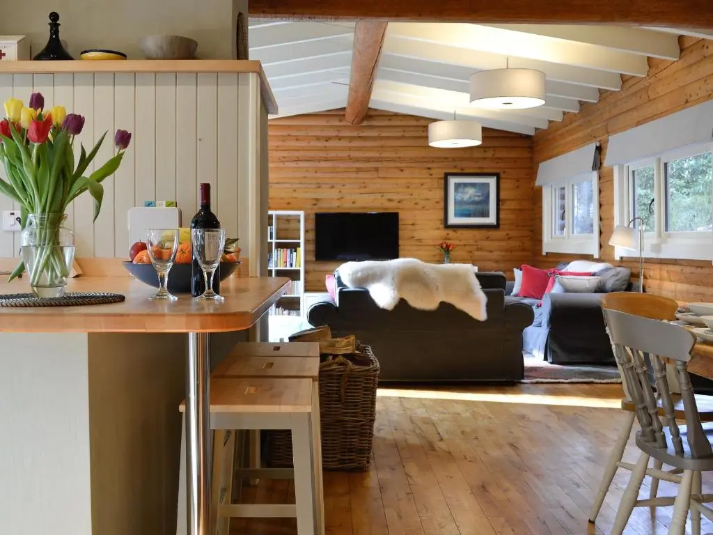 a living room with a couch and a table at Glen Hideaway in Balnald