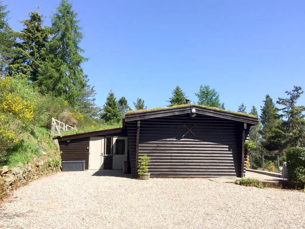 a garage with a large door on the side at Glen Hideaway in Balnald