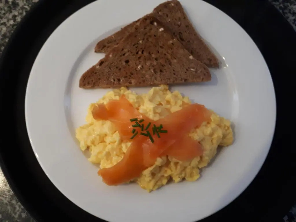 a plate of eggs with toast and a piece of bread at No 45, Ballater in Ballater