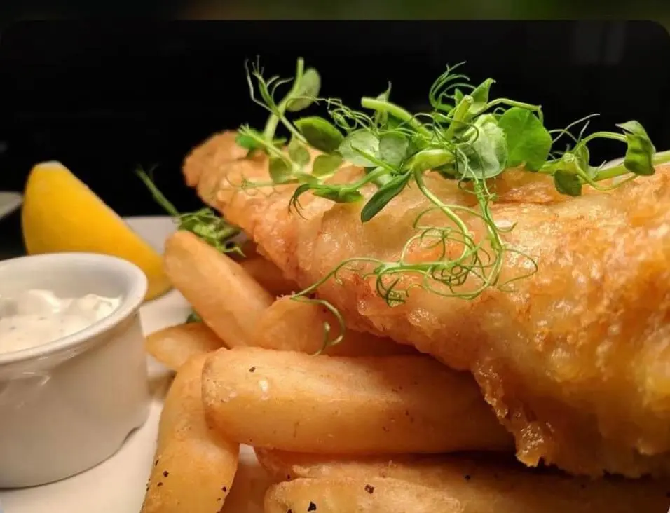 a plate of food with fish and french fries at Lovat Arms Hotel in Beauly