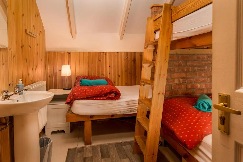 a bathroom with a bunk bed and a sink at Gulabin Lodge in Glenshee