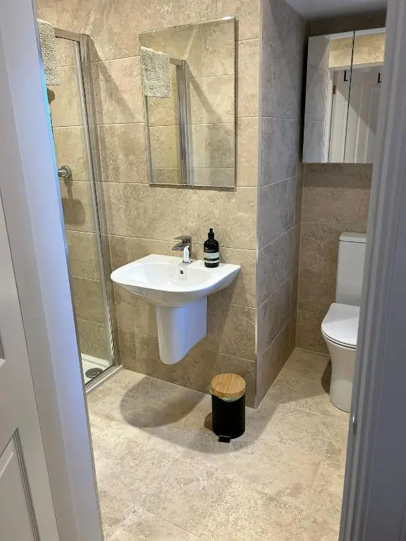 a bathroom with a sink and a toilet at The Castle B&B in Inverness