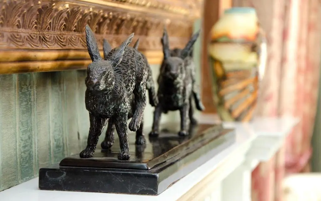a couple of statues sitting on a shelf at Ravenscourt House, Guest House in Grantown on Spey