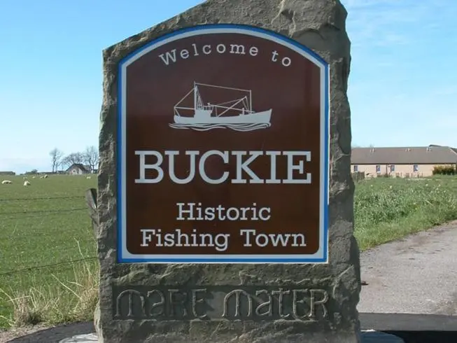 a sign for a buggie historic fishing town at Marine Hotel in Buckie