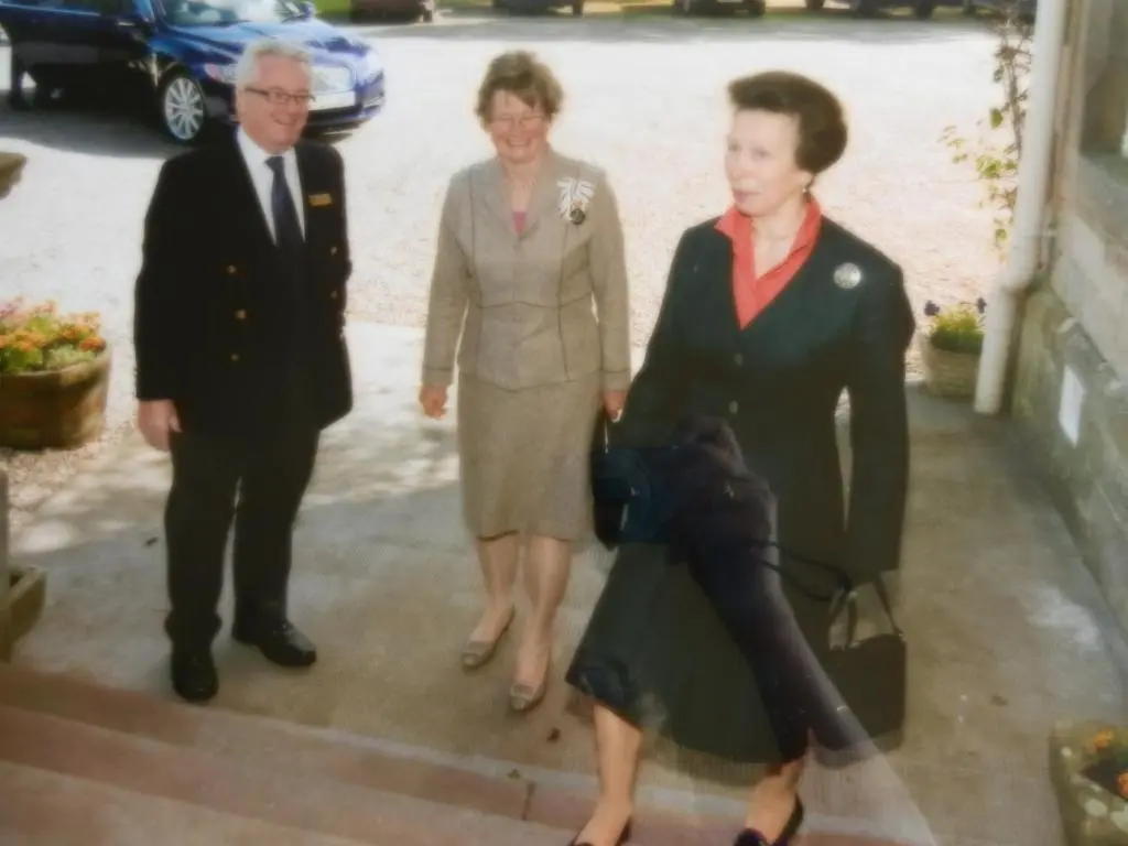 two women and a man standing next to a woman at Morangie Hotel Tain in Tain