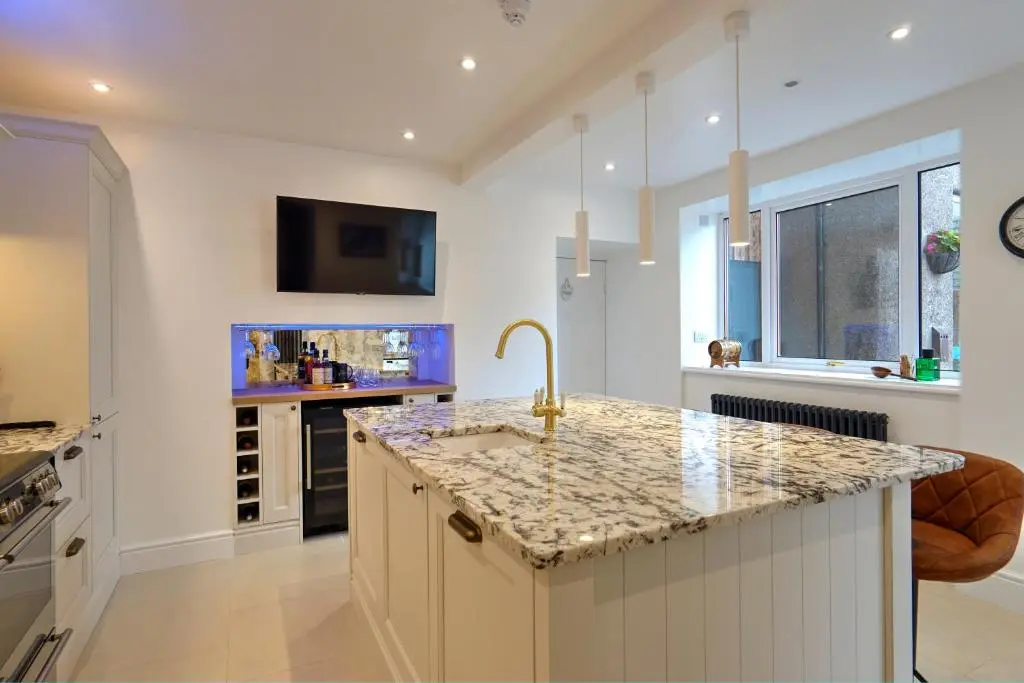 a kitchen with a sink and a counter top at The Tannochbrae in Dufftown