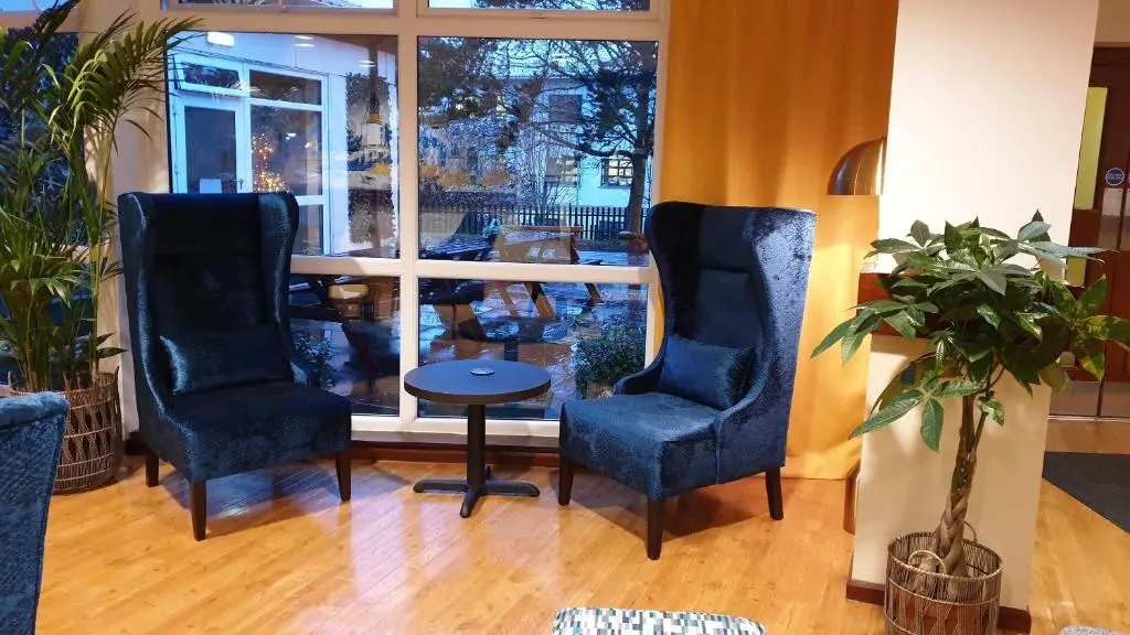 two chairs and a table in front of a window at Inverness Youth Hostel in Inverness