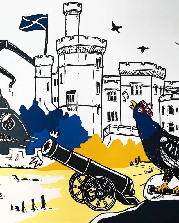 a bird on a cannon with a castle in the background at Inverness Youth Hostel in Inverness