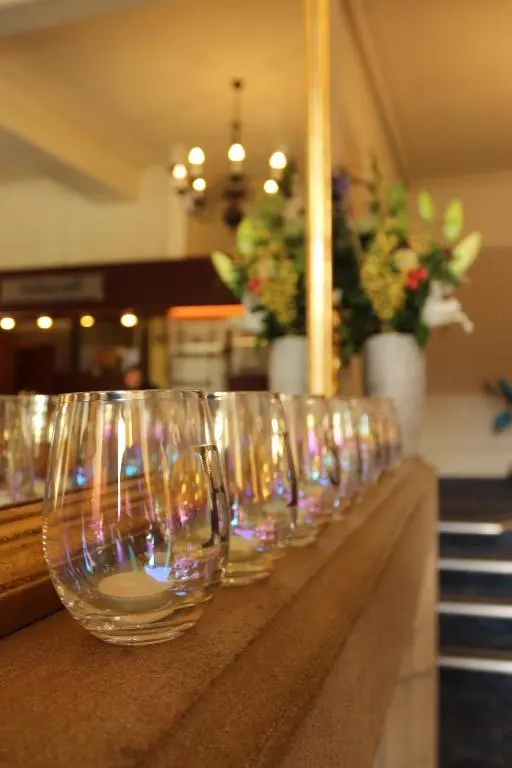 a row of wine glasses lined up on a counter at Craiglynne Hotel in Grantown on Spey