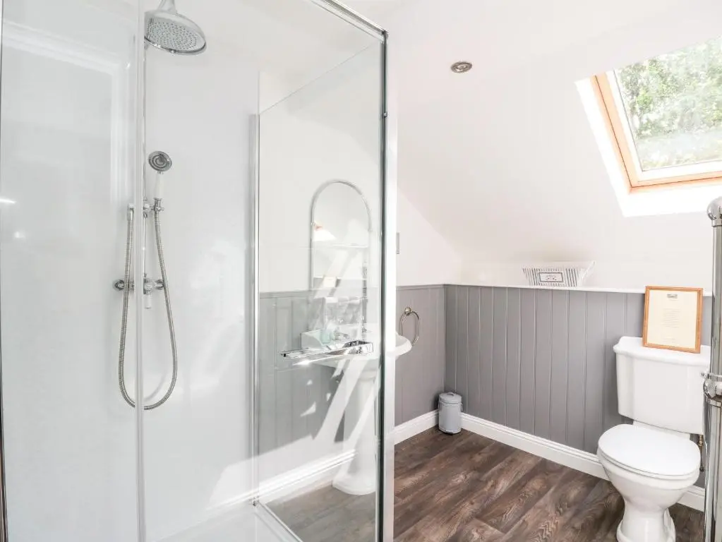a bathroom with a shower and a toilet at Tigh Na Drochit in Garve
