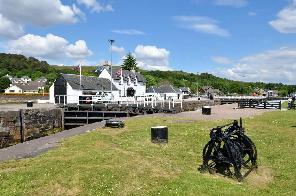 a group of bikes sitting on the grass near a dock at The Bridge Suite in Invermoriston