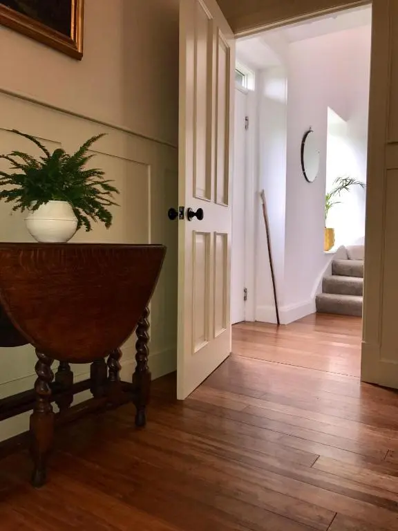 a hallway with a plant in a vase on a table at Dandaleith Cottage No.2 in Craigellachie