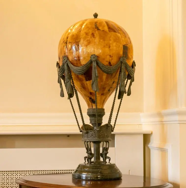 a vase sitting on top of a table at Grant Arms Hotel in Grantown on Spey