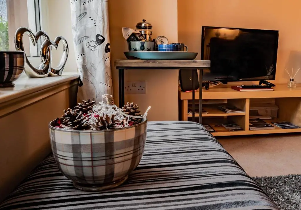 a bowl sitting on top of a table in a living room at No.3 On The Square in Beauly