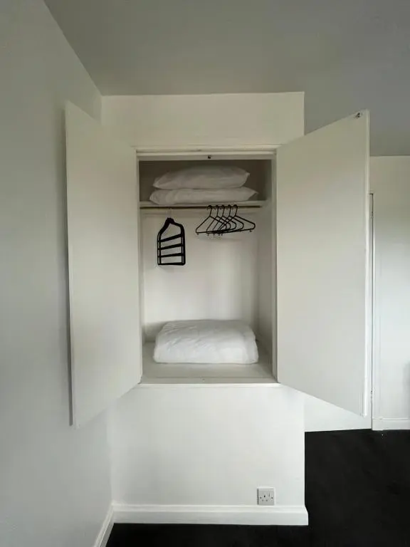 a white cabinet with a bed in it at Inverness House in Inverness