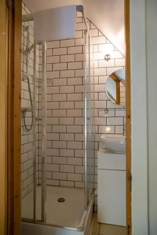 a bathroom with a shower and a sink at Ptarmigan in Aviemore