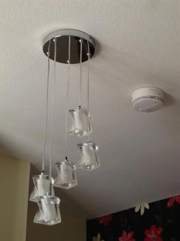 a bunch of chandeliers hanging from a ceiling at Dunvegan Bed & Breakfast in Dufftown