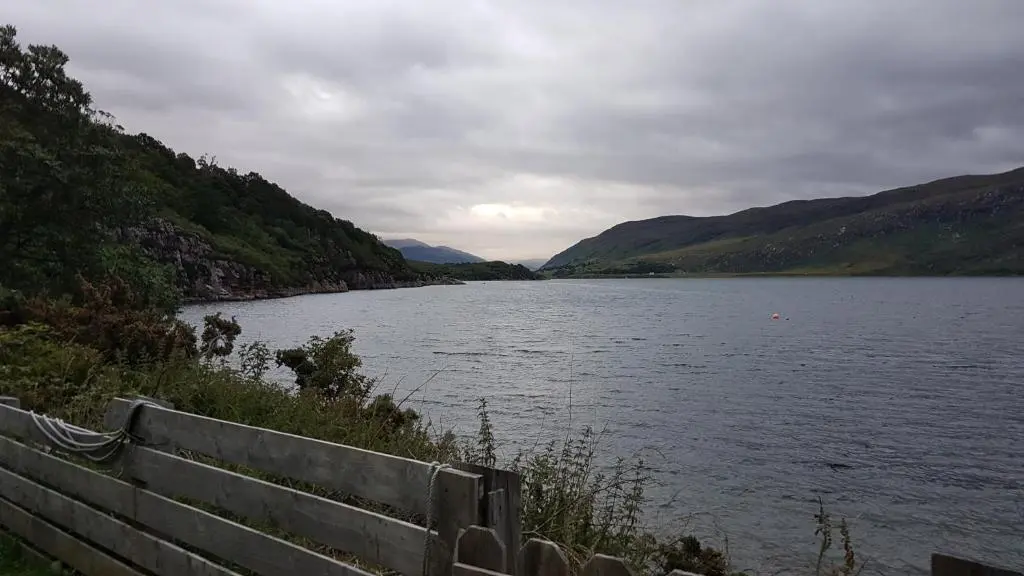 a view of a body of water with mountains at Lochview Guest House in Ullapool
