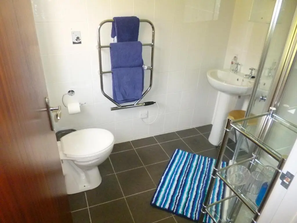a bathroom with a toilet and a sink at Aslaich in Drumnadrochit