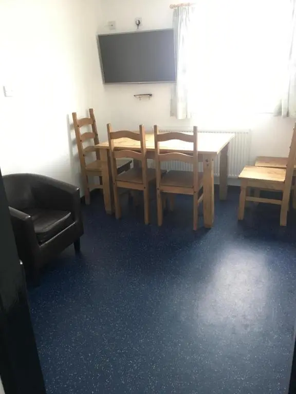 a dining room with a table and chairs at Ledgowan Bunkhouse in Achnasheen
