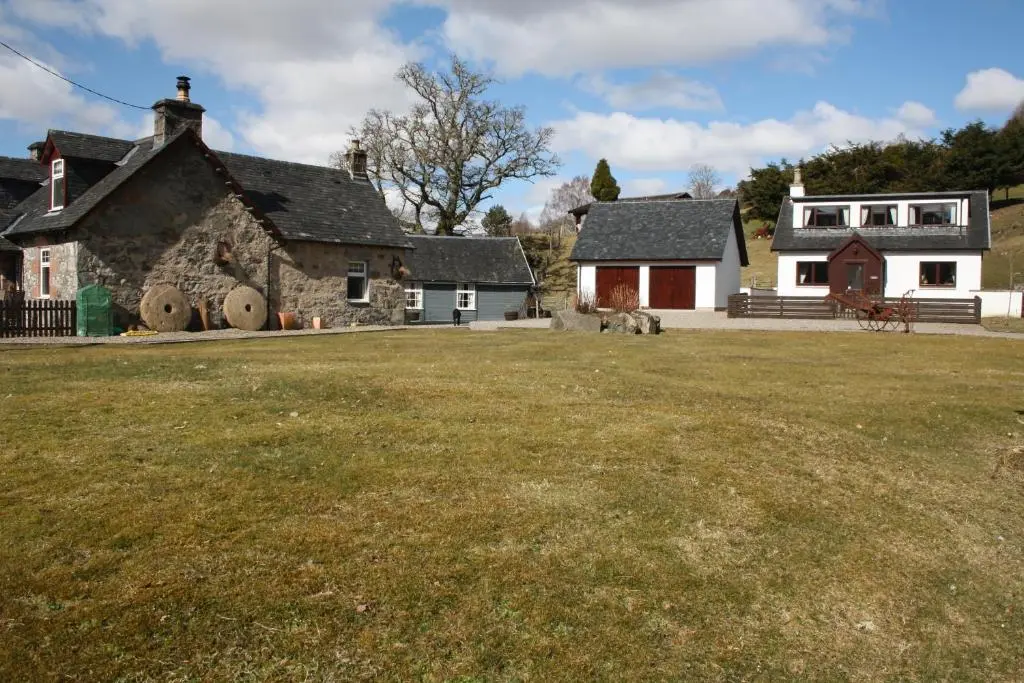 a large yard in front of a house at Ardgarry Farm in Invergarry
