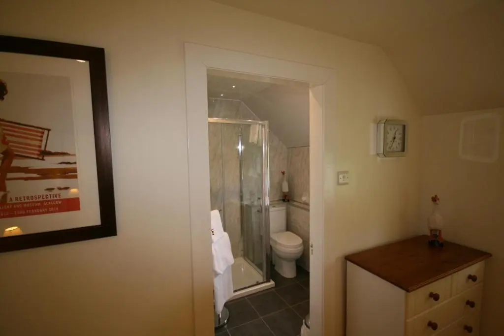 a bathroom with a shower and a toilet at Ardgarry Farm in Invergarry