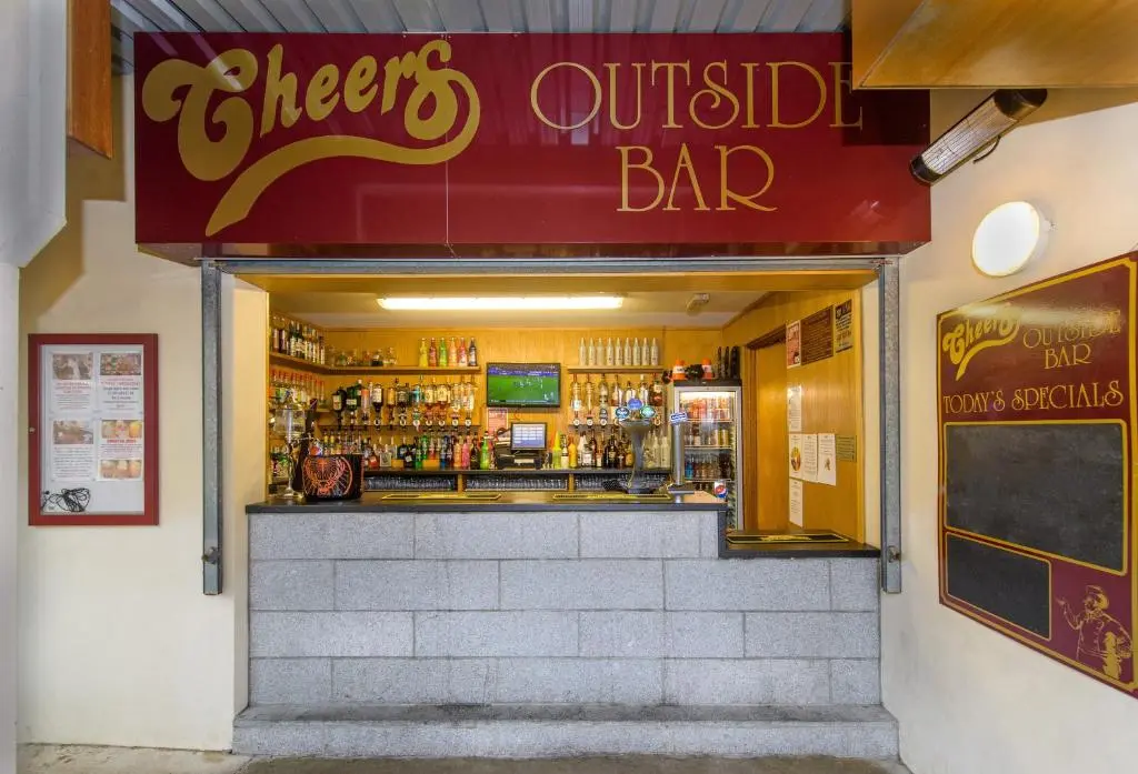 a restaurant with a sign that reads cheers outside bar at Cheers Cafe Bar & Tavern in Fraserburgh