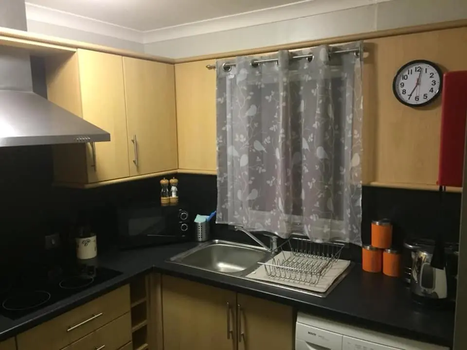 a kitchen with a sink and a shower curtain at The Cottage Aberlour in Aberlour