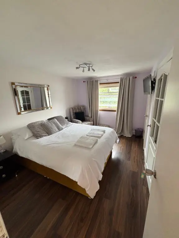 a bedroom with a large bed in a room at No.9 in Inverness