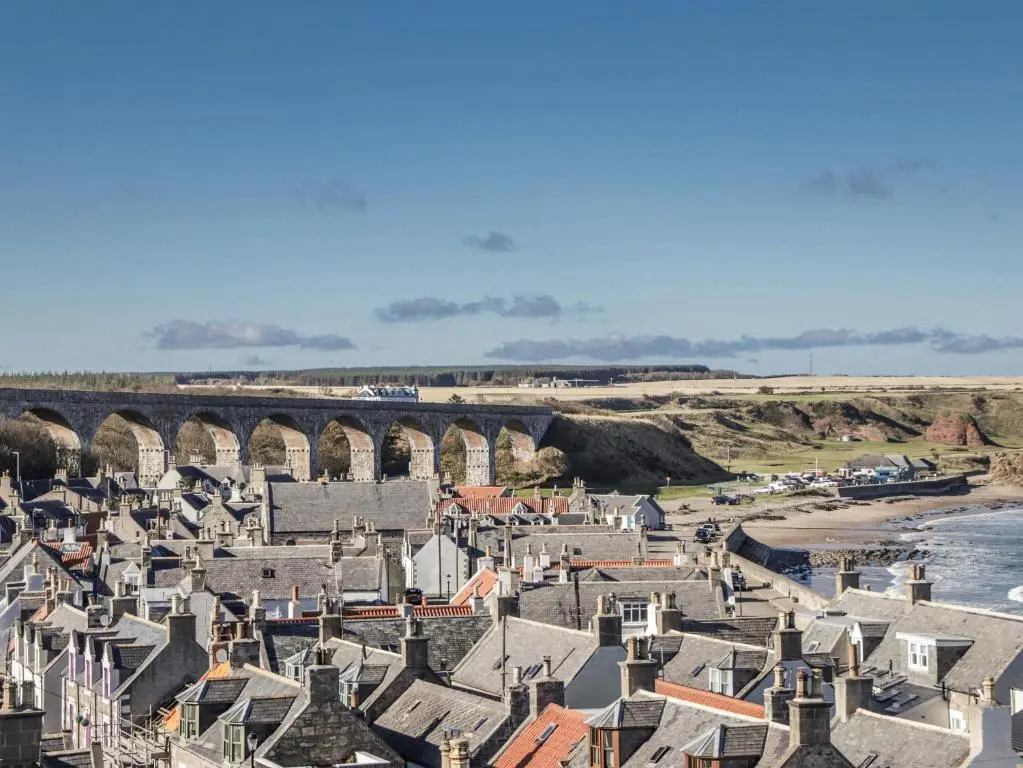 a view of a town with a train crossing a bridge at 83 Seatown in Buckie