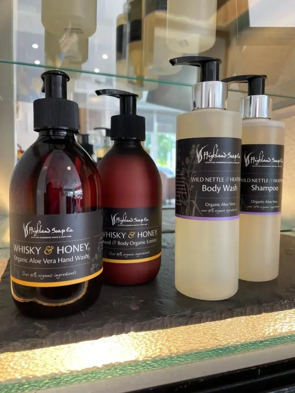 three bottles of hair products sitting on a shelf at The Speyside Hotel and Restaurant in Grantown on Spey