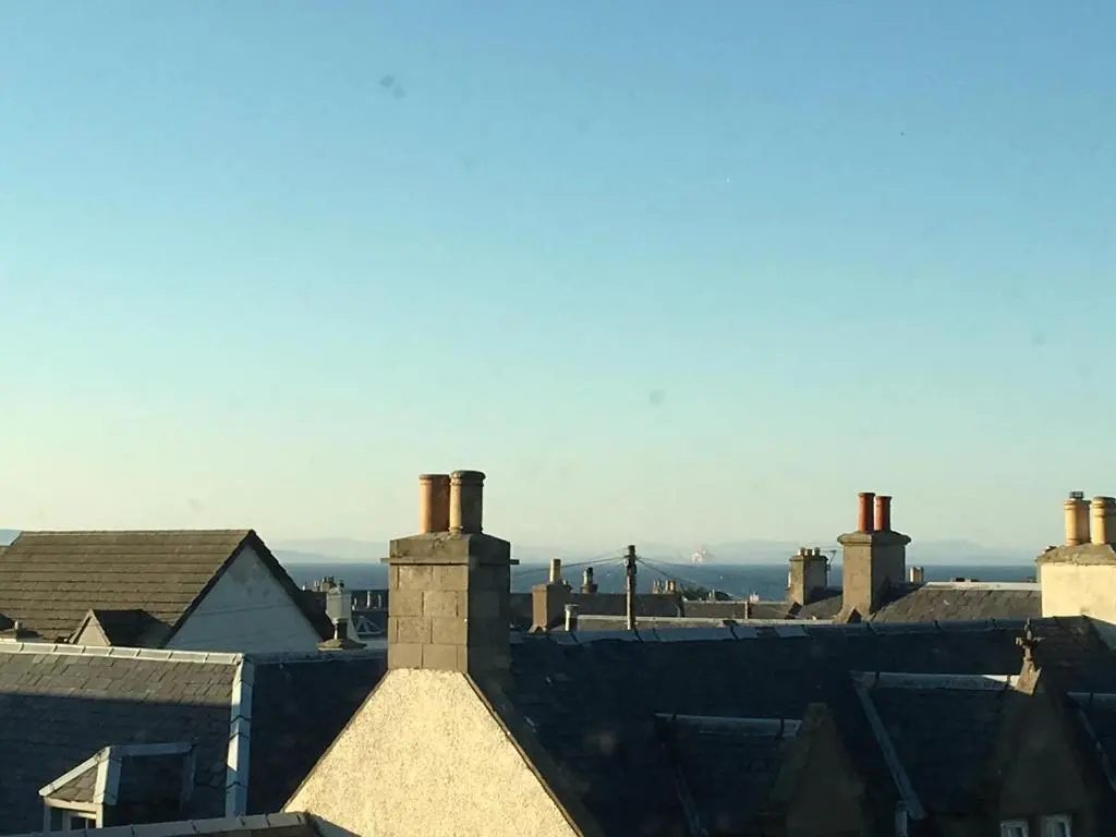 a view of roofs of houses with chimneys at Riverbank Apartments in Nairn