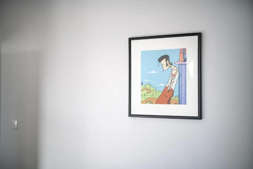 a painting of a woman on a wall at Dryburgh Apartments No2 in Inverness