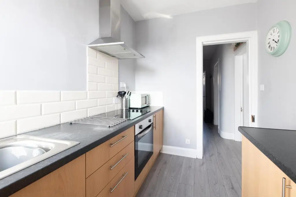 a kitchen with a sink and a counter top at Dryburgh Apartments No2 in Inverness