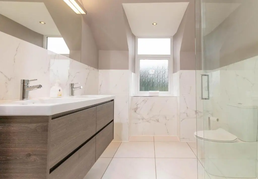 a bathroom with a sink and a shower at Convalmore House in Dufftown