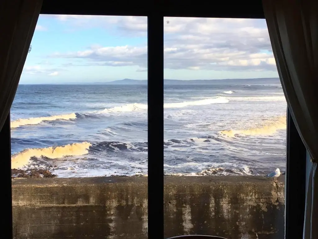 a view of the ocean from a window at 3 Marina Quay in Lossiemouth