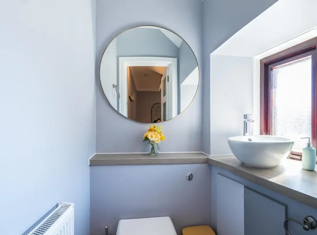 a bathroom with a sink and a mirror at BlueNess in Inverness