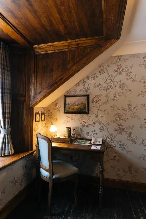 a room with a desk and a chair in a room at Rokeby Manor in Invergarry