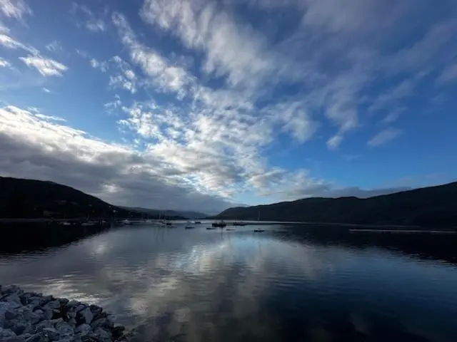 a view of a lake with a cloudy sky at Argyll Hotel in Ullapool
