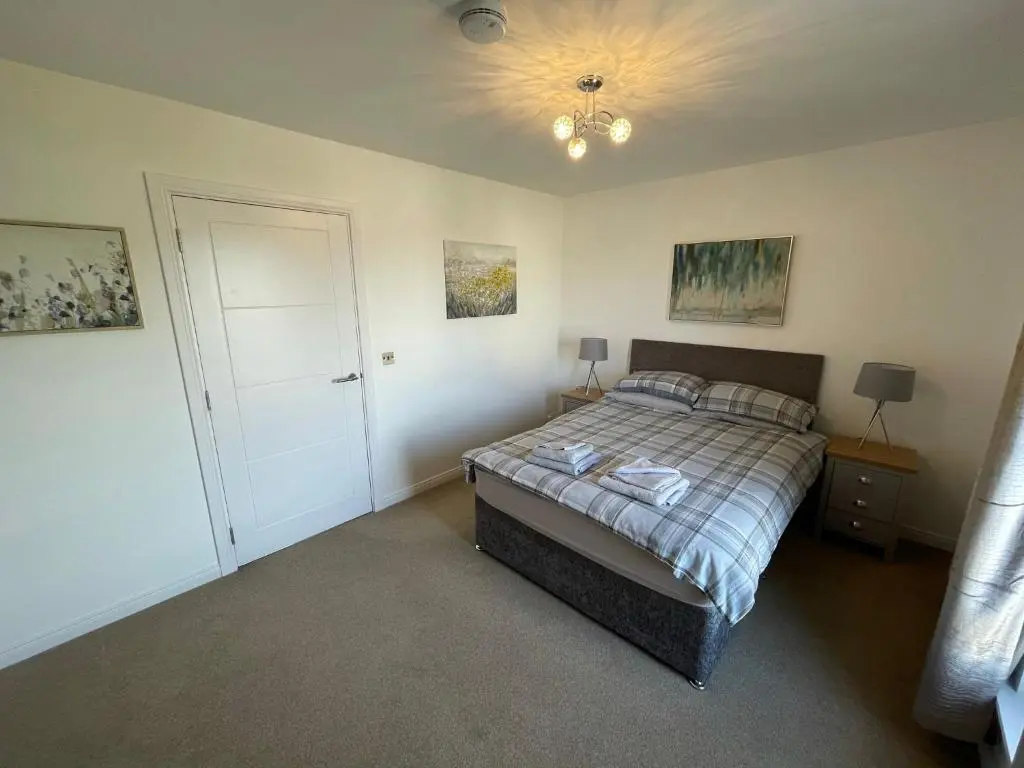 a bedroom with a bed and a ceiling at Gorsebank View in Inverness