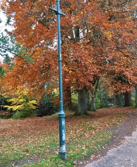 a pole with a cross on it in a park at Wellingtonia Court Apartment in Inverness